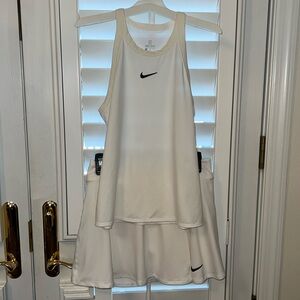 Nike pickleball/tennisis top and skirt with shorts underneath 
Size medium